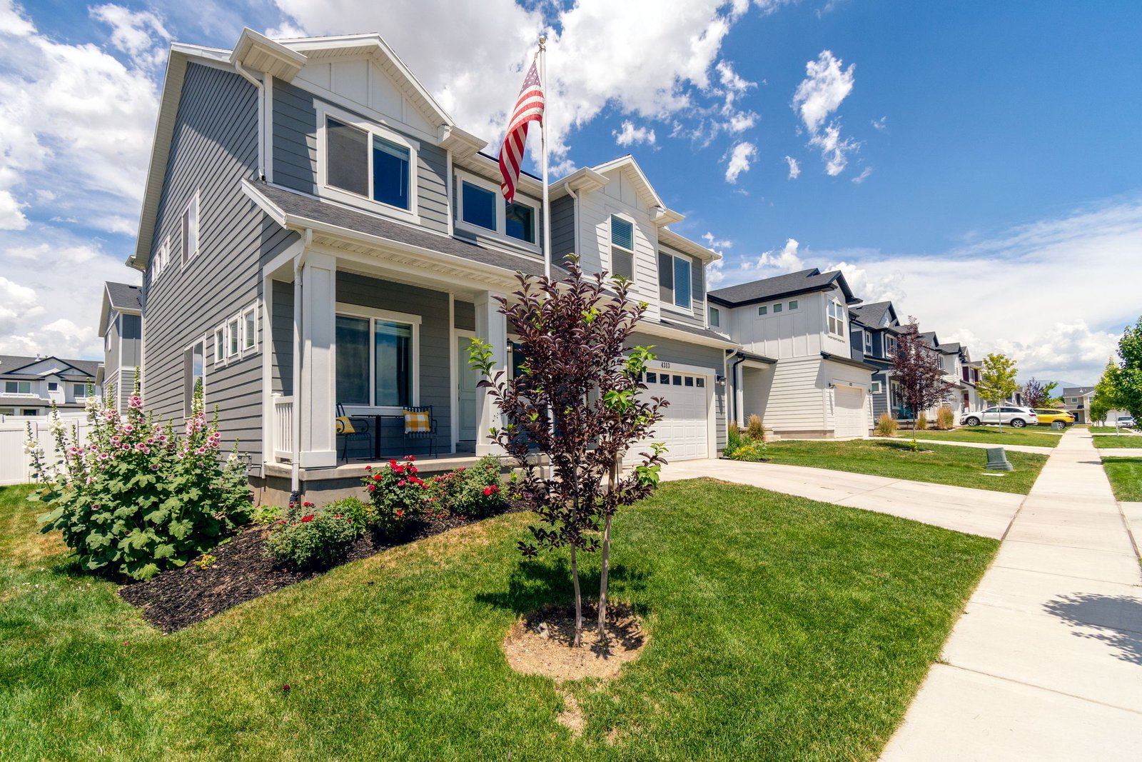 Bright, freshly painted suburban house exterior on a sunny day — exterior house painting by NICA Painting, house painters serving Hayward, CA and the Bay Area